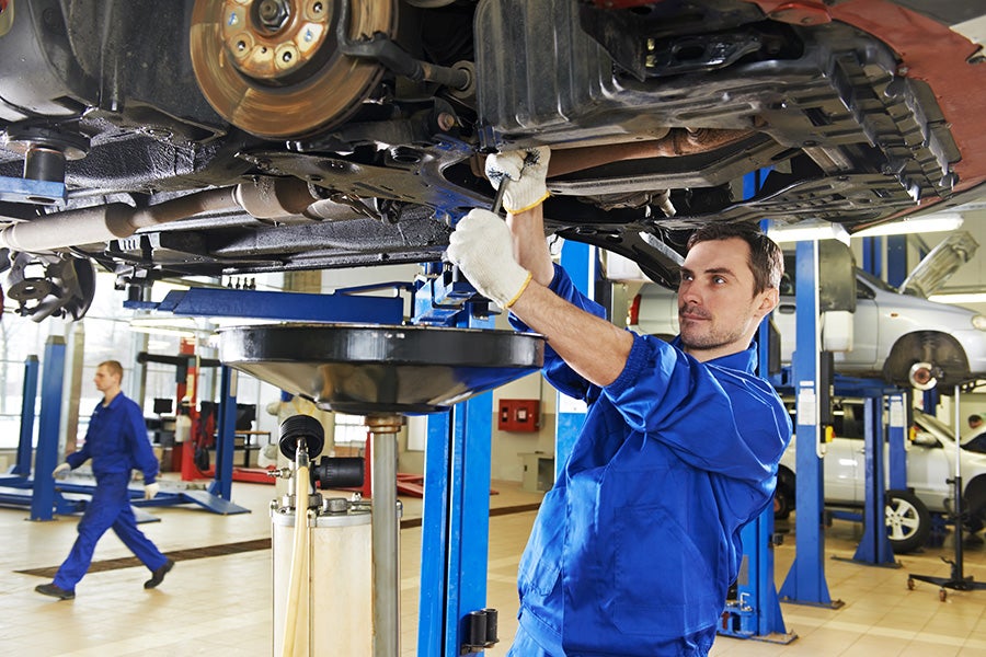 techinician working under car